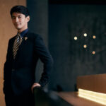 Confident executive portrait in bar lounge.