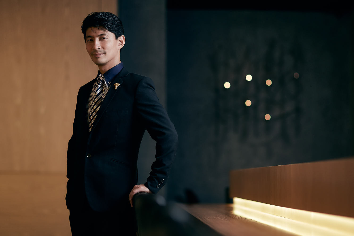 Confident executive portrait in bar lounge.