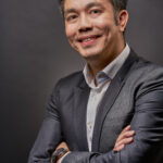  A sharp and polished corporate executive portrait highlighting professionalism and confidence in formal business attire.