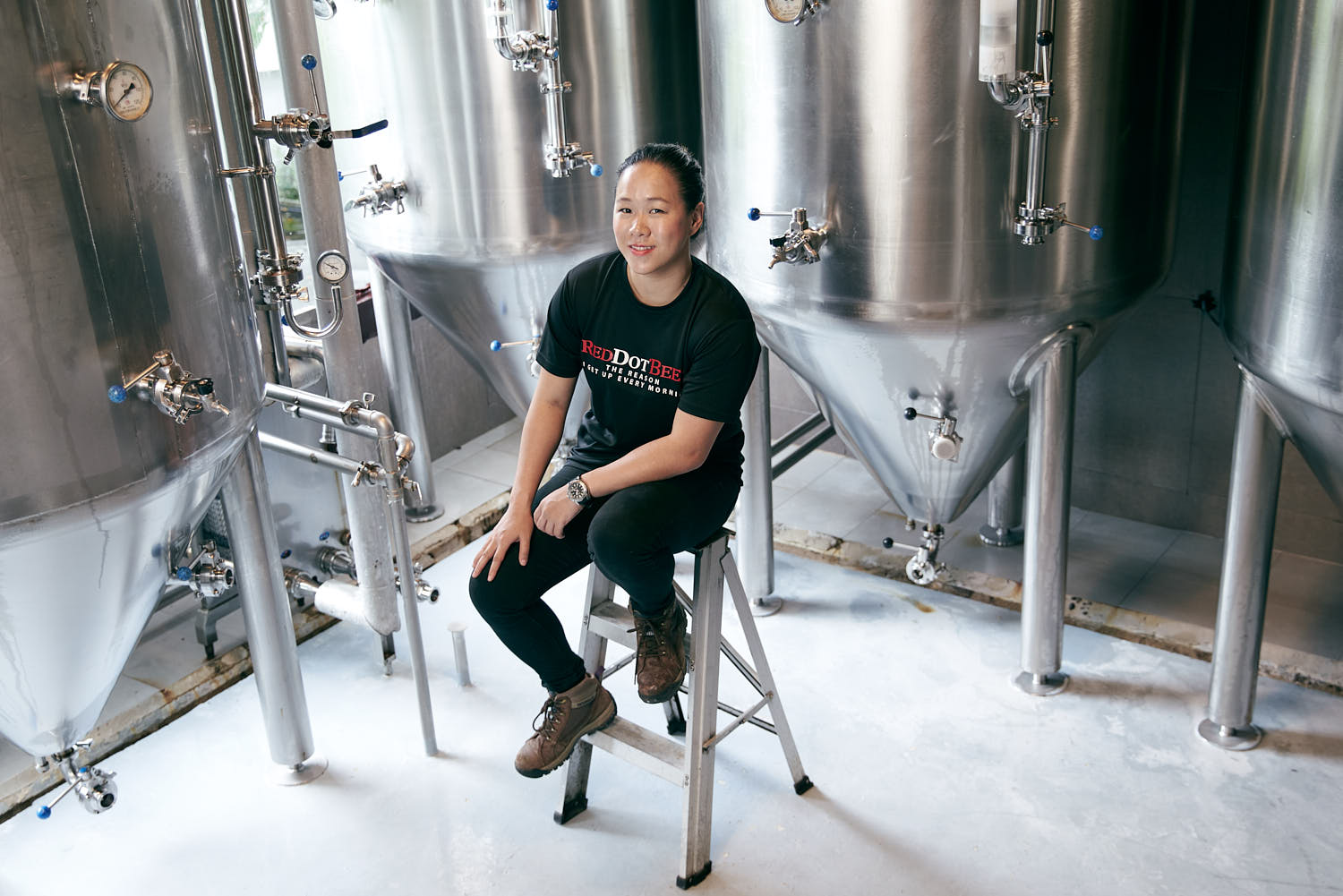 Female entrepreneur full-body headshot.