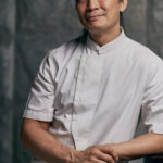 Half body portrait of celebrity chef Susur Lee in Tung Lok Heen RWS.