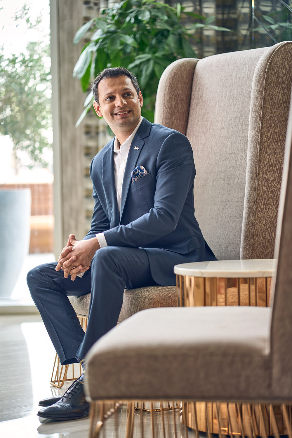 Portrait of smiling hotelier in luxurious hotel lounge.