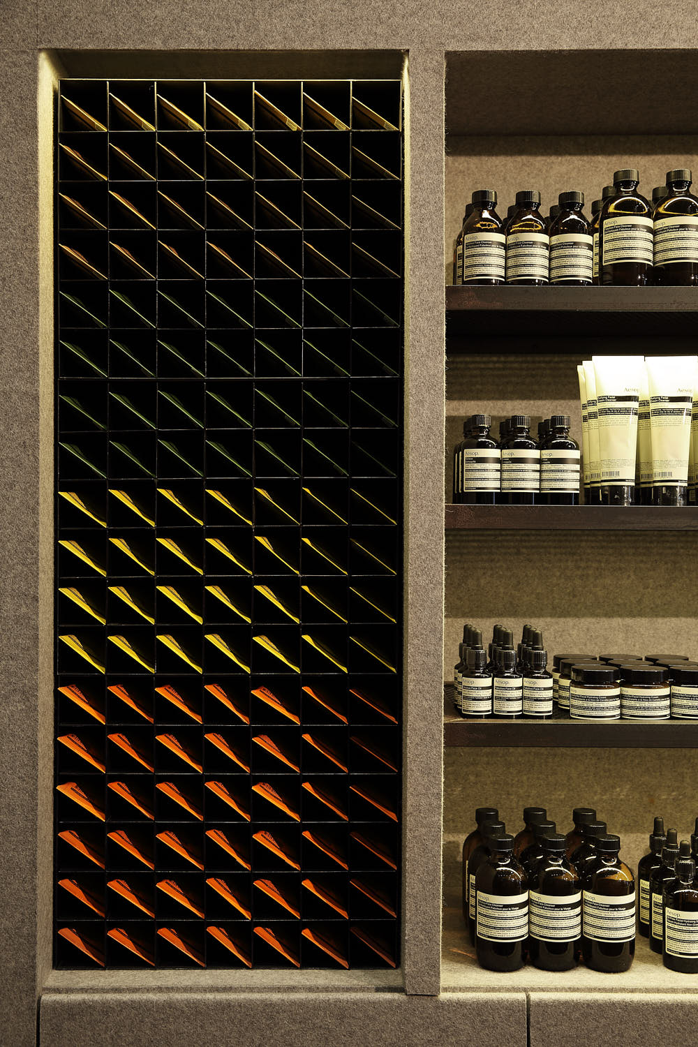 Close-up of Aesop product display in a flat, graphic composition with minimalist styling.