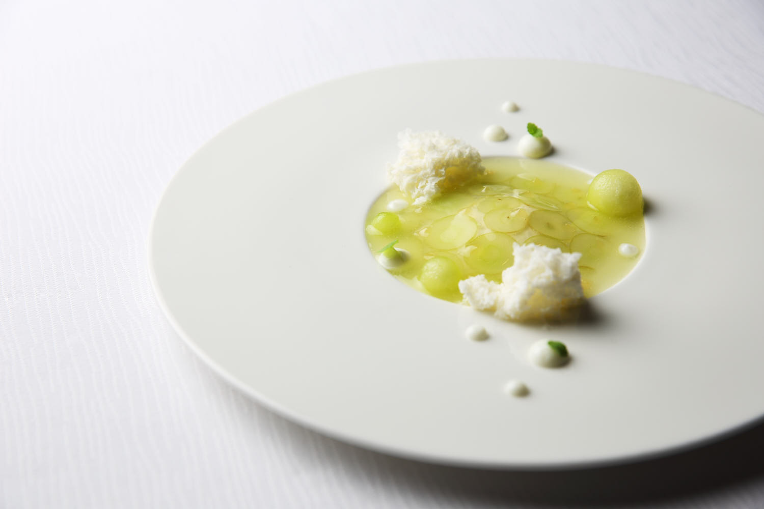 Artfully plated fine dining dessert with fruits at Andre Singapore.