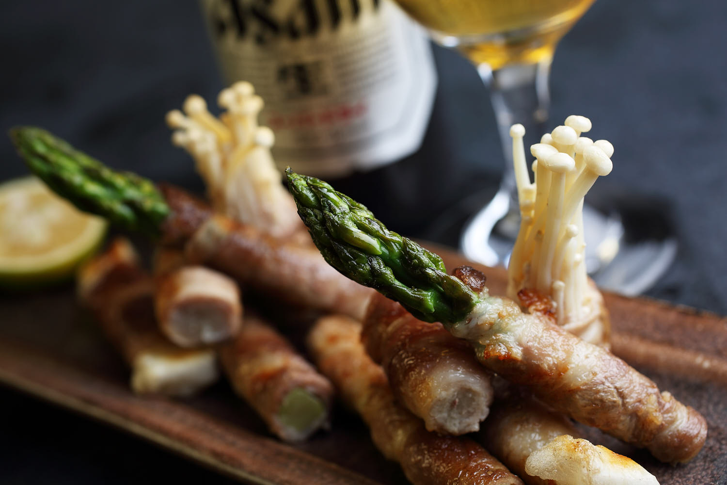 Close-up of perfectly grilled bacon-wrapped asparagus, with crispy bacon edges and vibrant green asparagus tips.