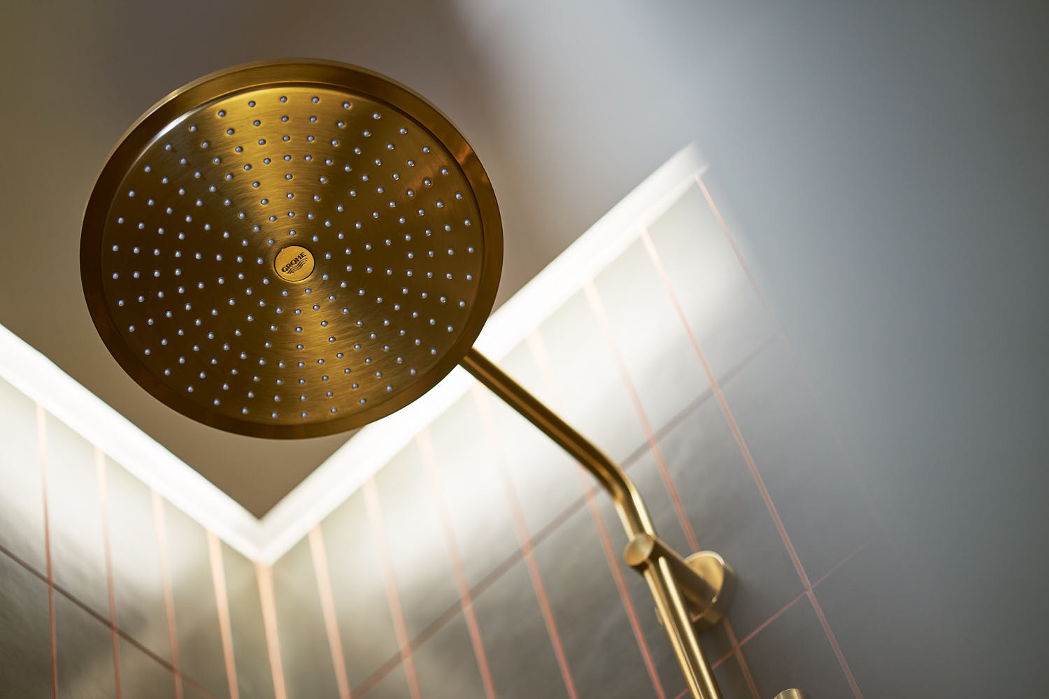 Close-up of a brass shower fixture with sleek design.