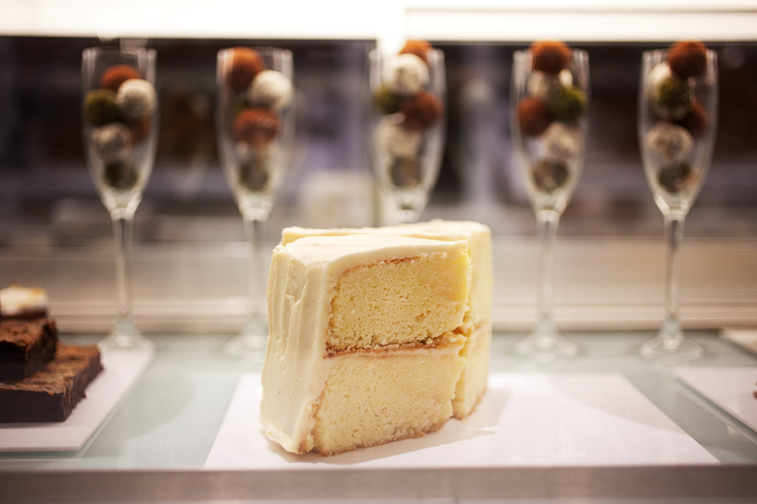 Close-up of a perfectly frosted vanilla cake.