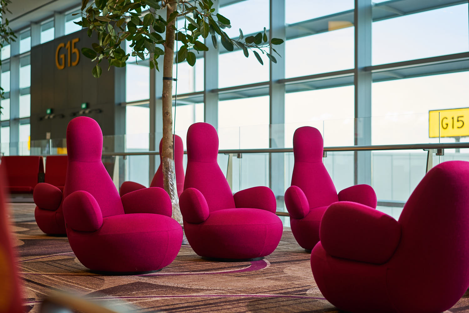 Individual sofa seats arranged for personal comfort at Changi Terminal 4.