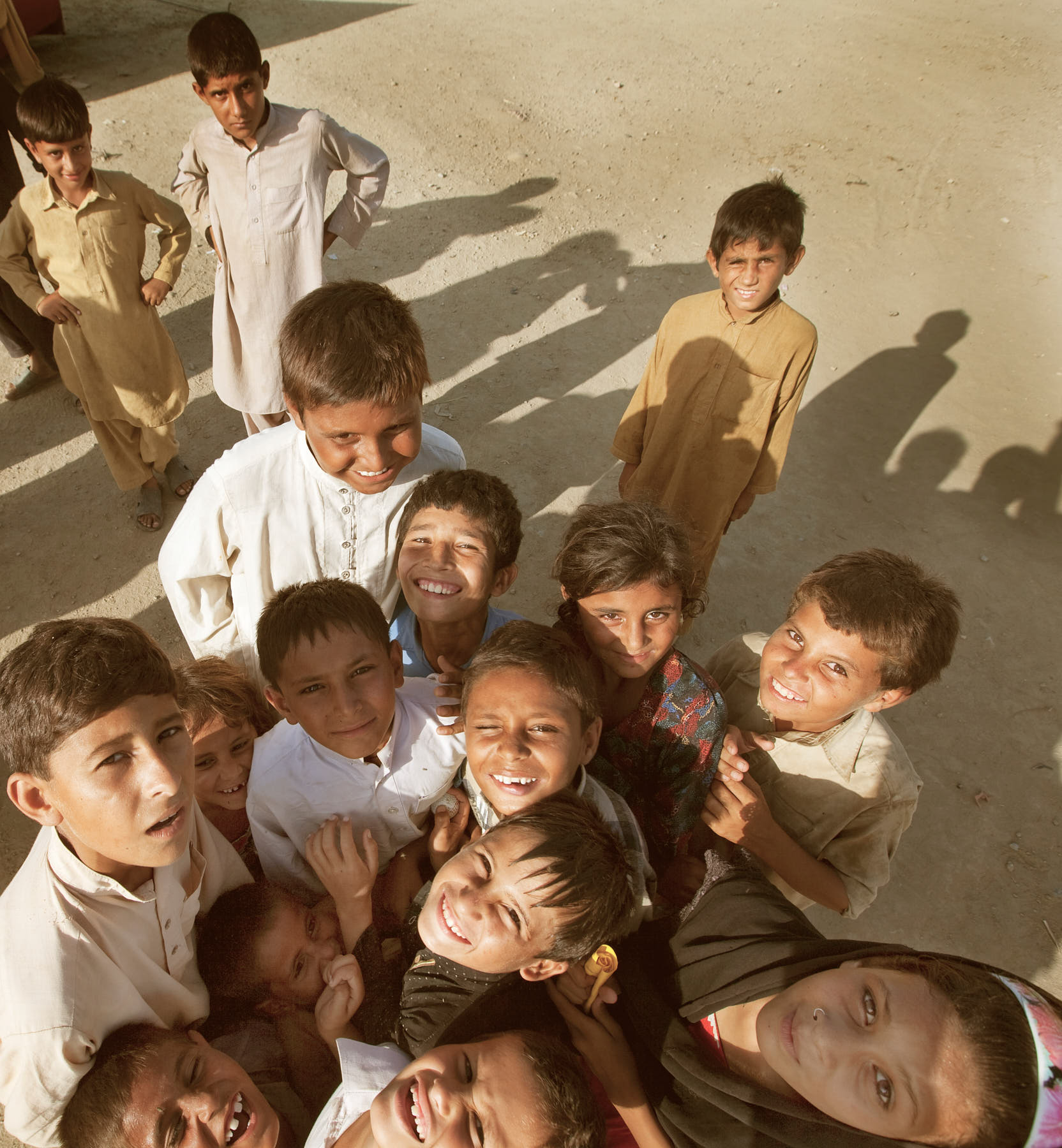 Children having fun and playing in a refugee camp in Charsadda, Pakistan, August 2010.