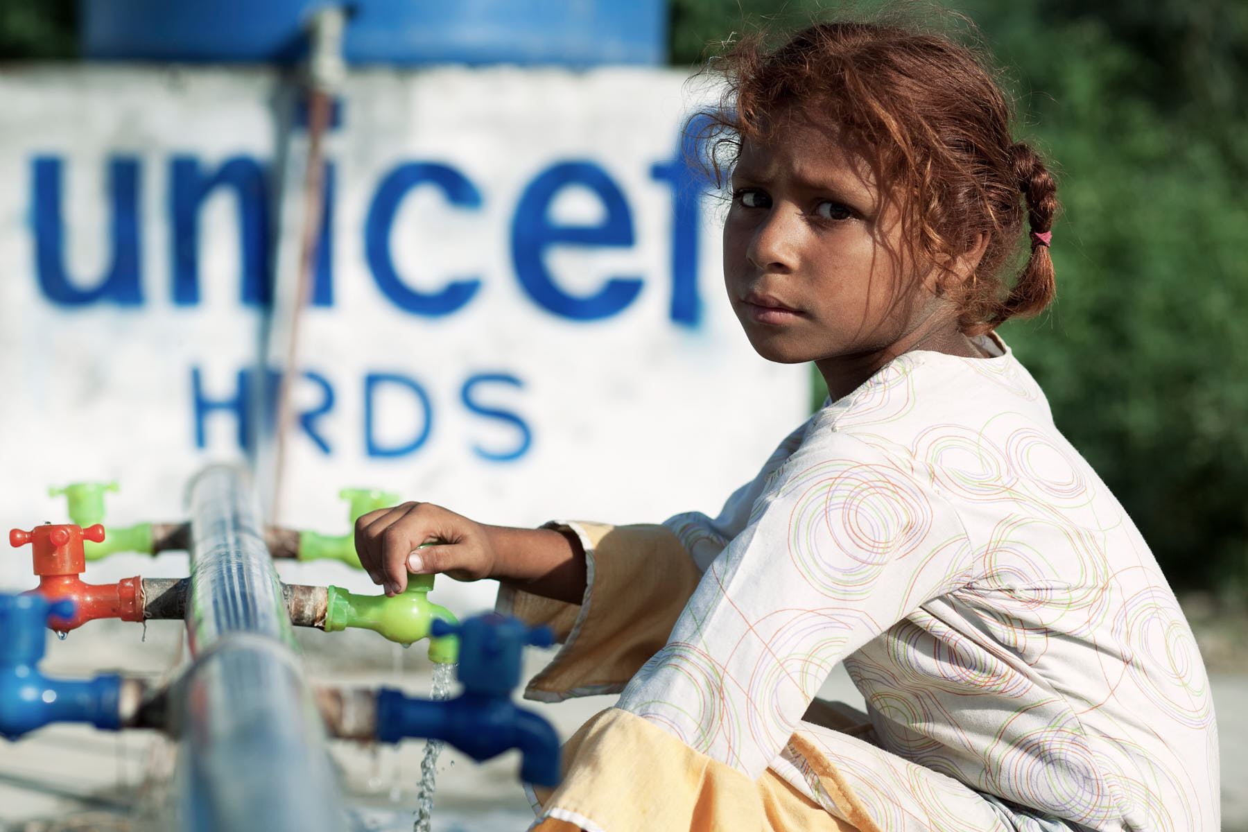 UNICEF, through local partner HRDS, delivers water to a refugee camp in Charsadda, Pakistan, August 2010. Despite the disaster being one of the worst in recent times, it received minimal international support.