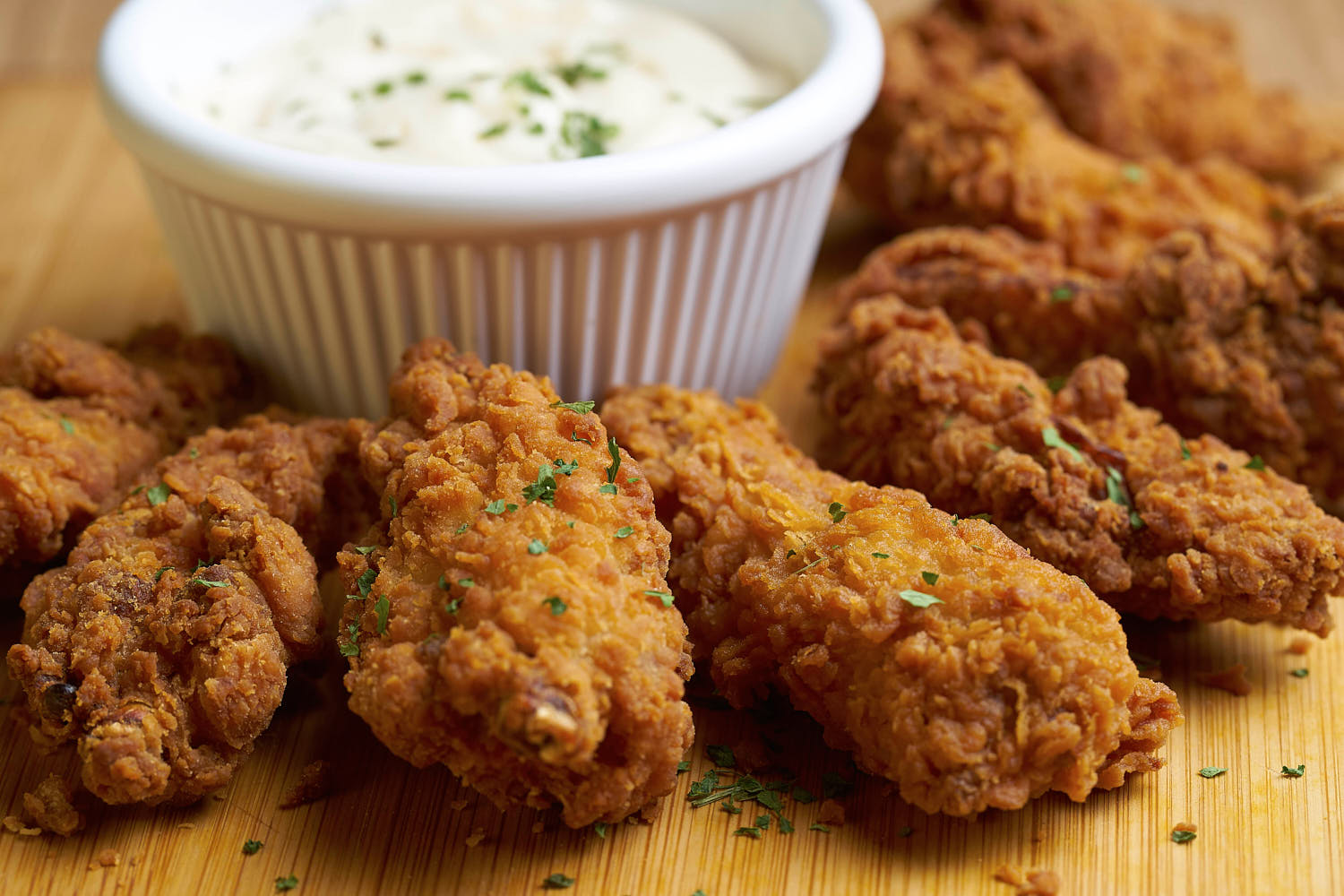 Crispy chicken drumplet paired with sour cream.