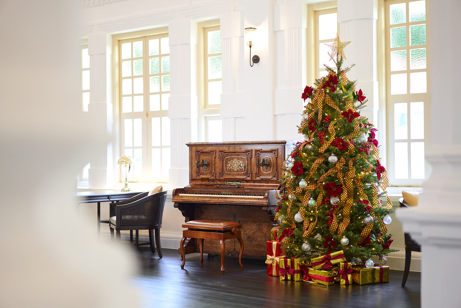 Festive Christmas tree decorated inside Raffles Hotel.