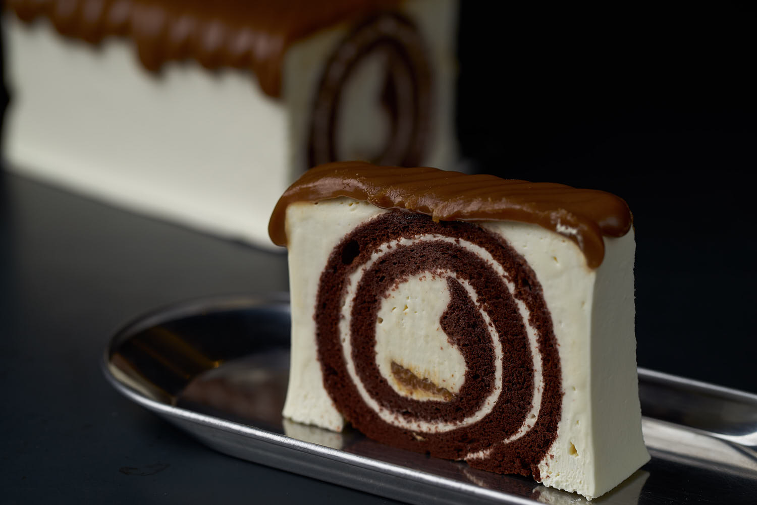 Mood shot of vanilla chocolate swirl cake.