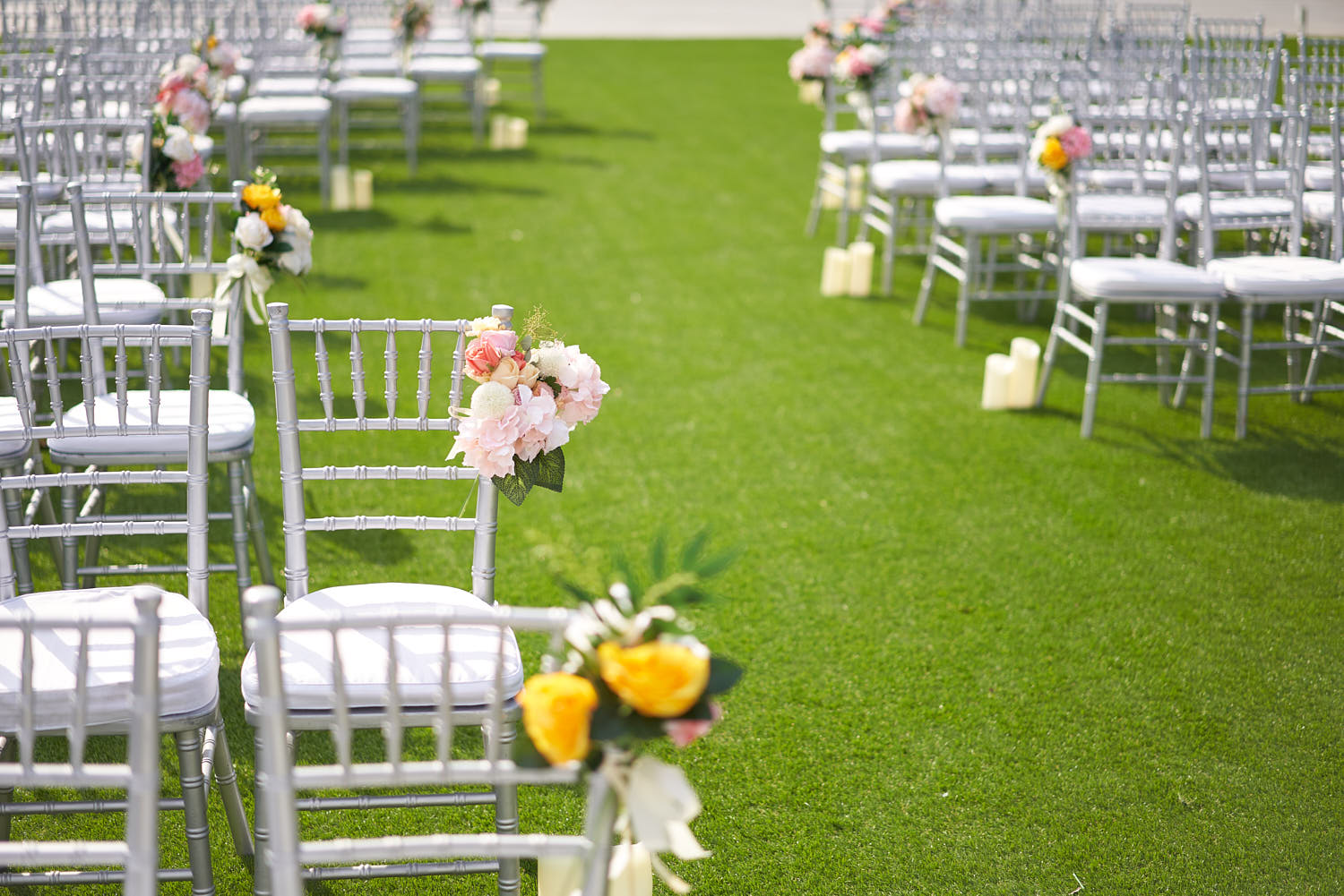 Close-up of a guest chair in an outdoor wedding setup at The Barracks Hotel.