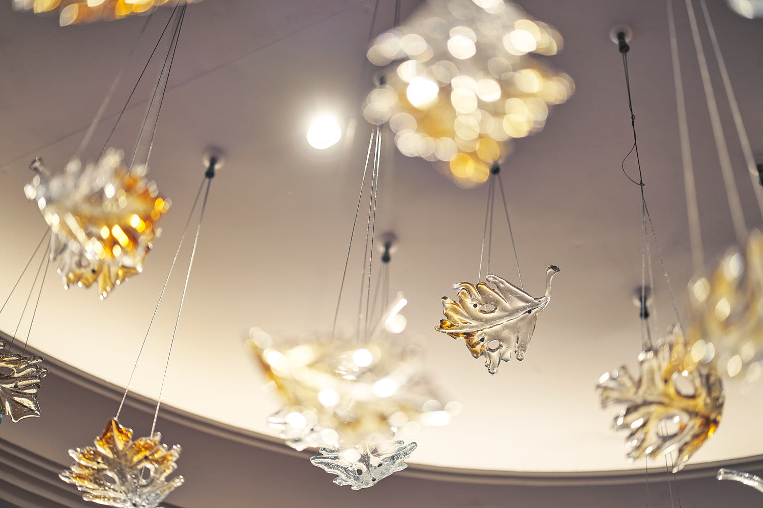 Close-up of an elegant hotel chandelier with crystal details.