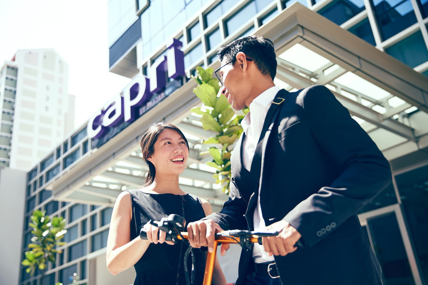 Colleagues casually chatting as they return to their hotel after a day at work.