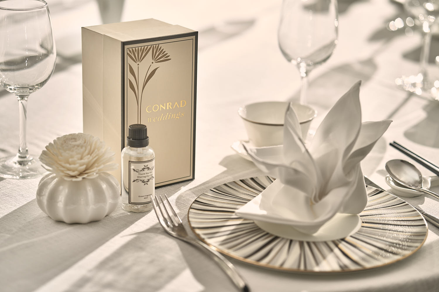Elegant wedding table setting at Conrad Hotel.