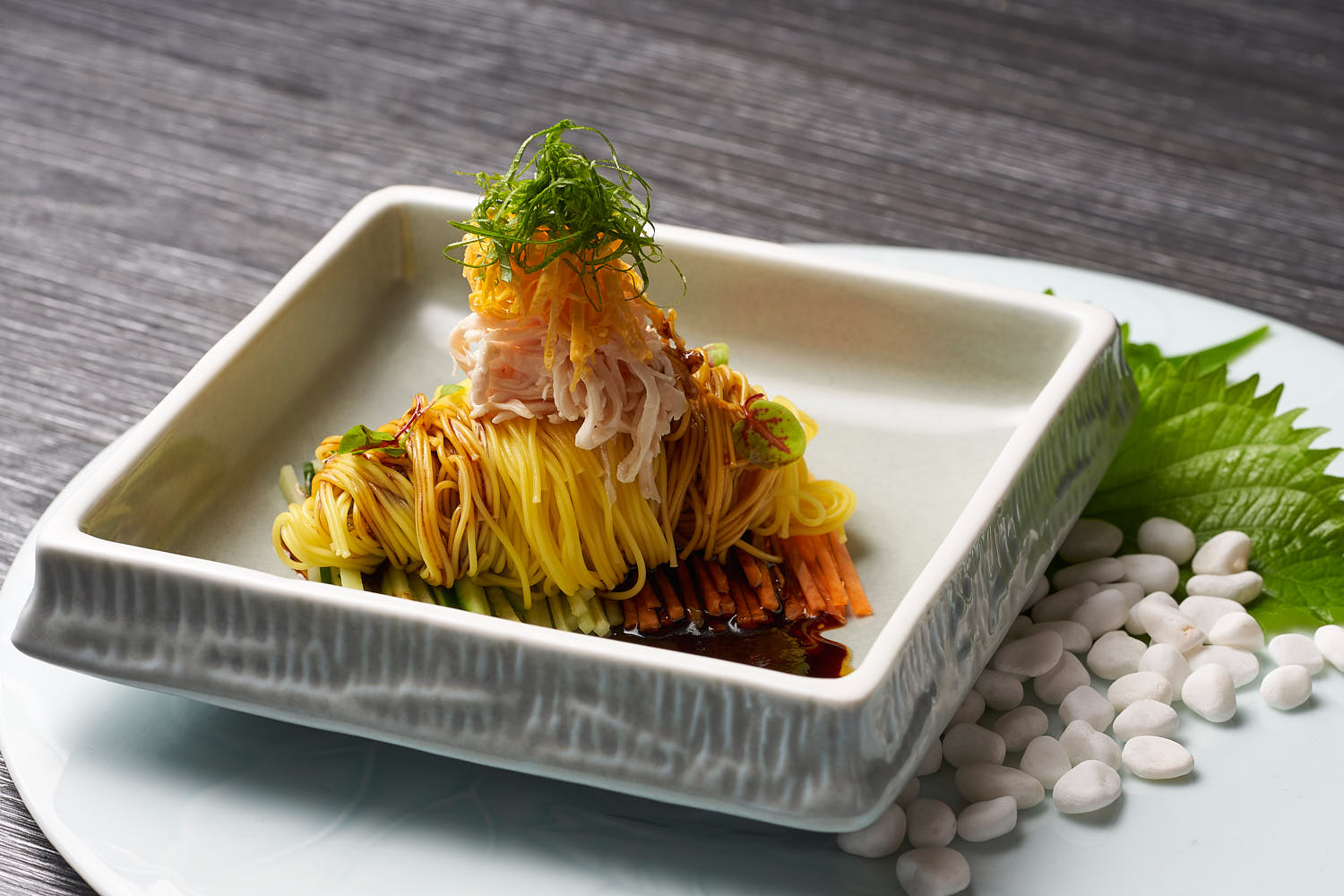 Refreshing Asian noodle dish with tender chicken shreds, crisp cucumber, and carrot strips.