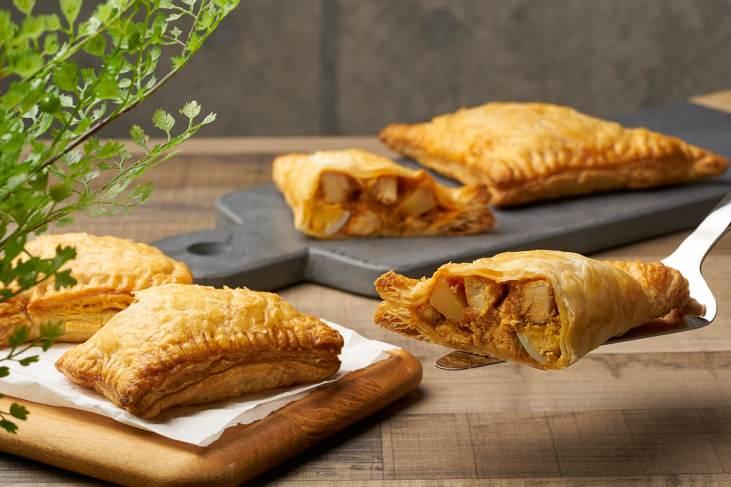 Assorted curry puffs with golden flaky pastry and spicy filling.
