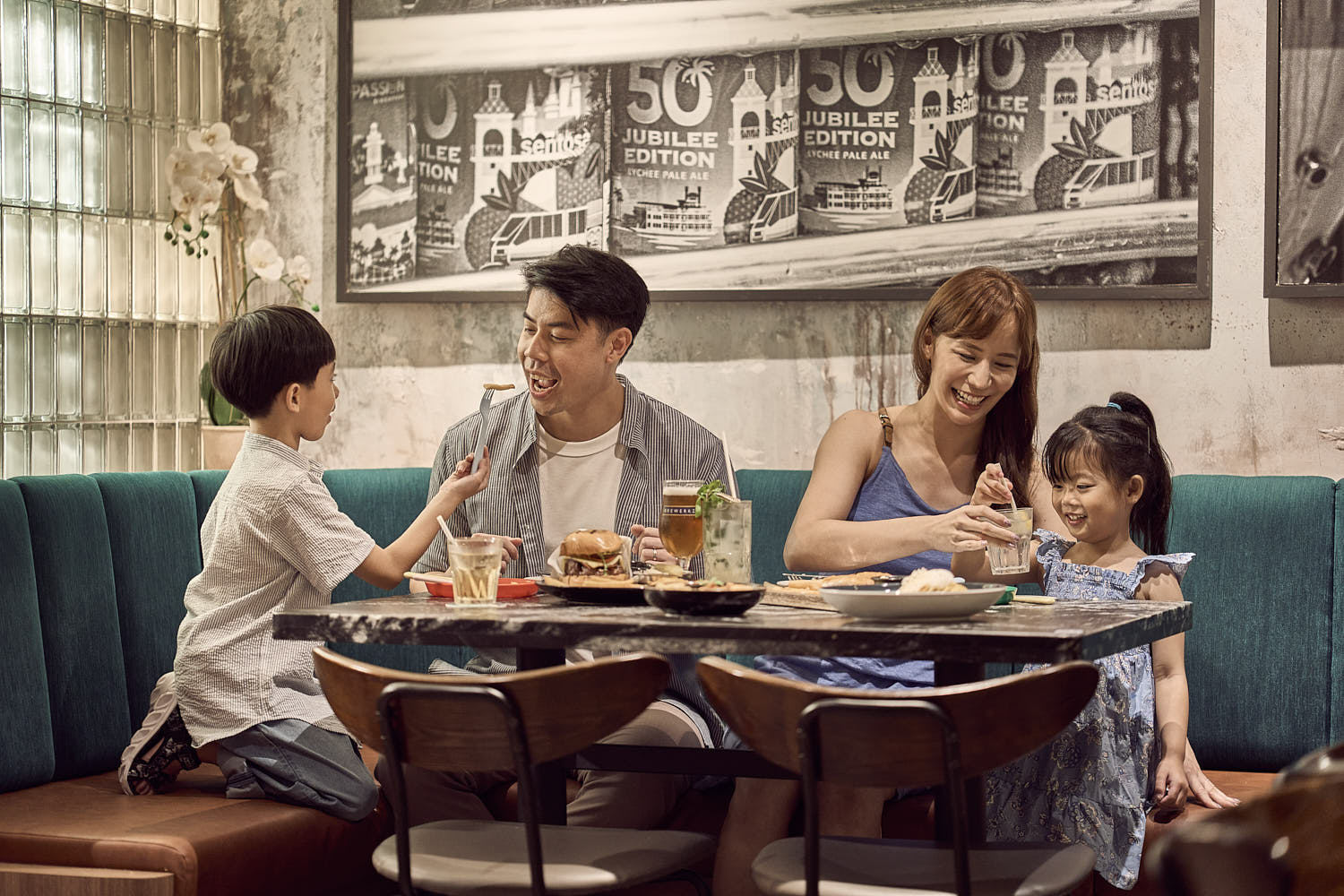 Family enjoying a delicious buffet breakfast together at a luxury hotel.