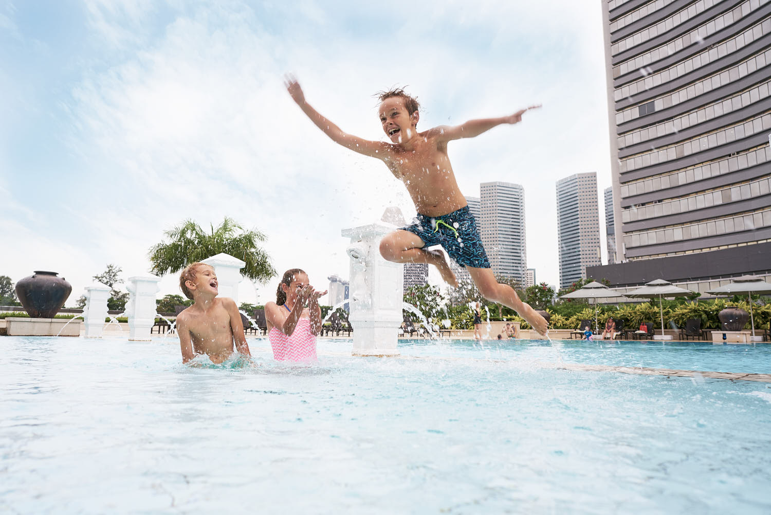 Family exploring fun water activities at a resort for an exciting vacation.