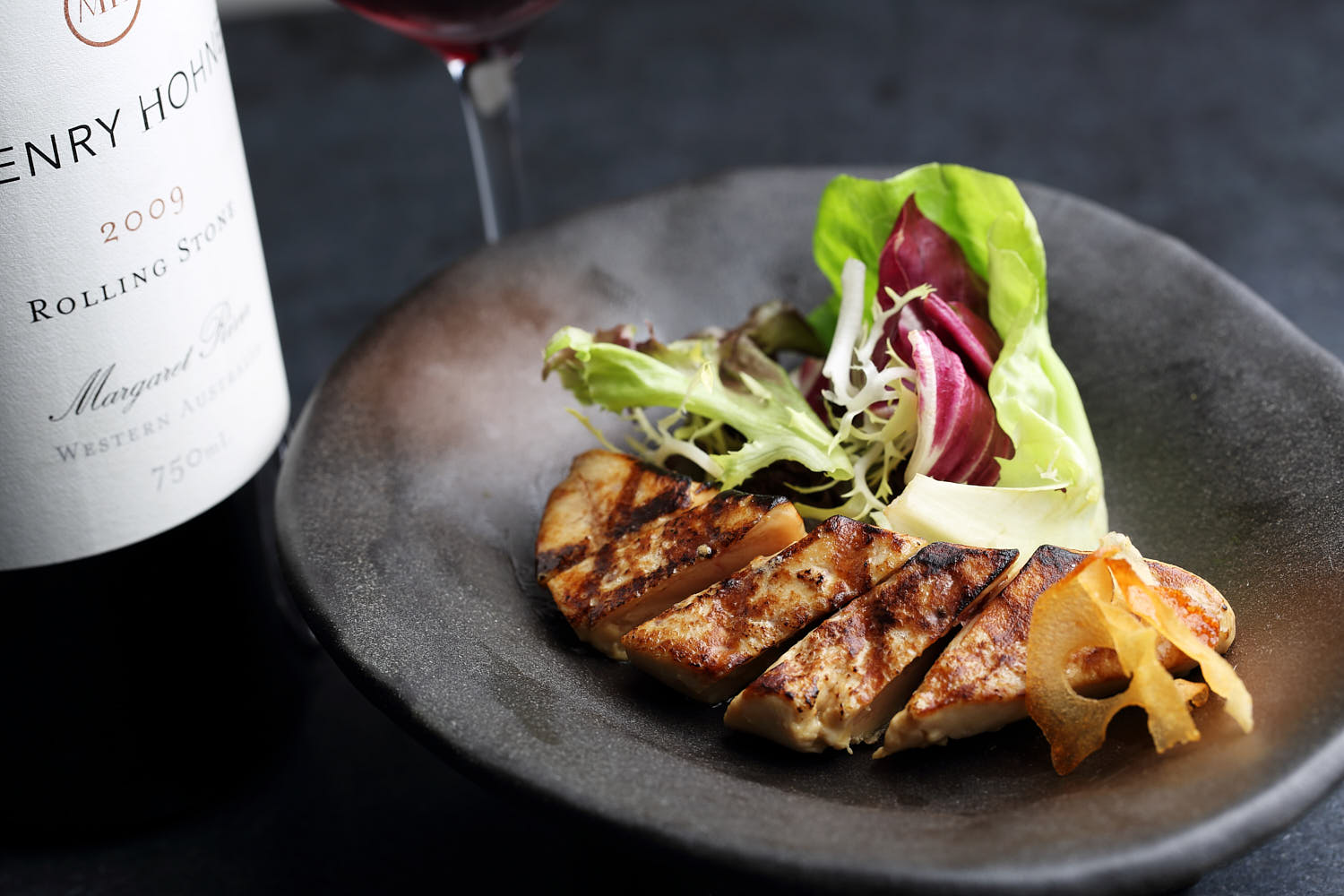 Luxurious foie gras served with a fresh mixed salad, drizzled with a balsamic reduction.