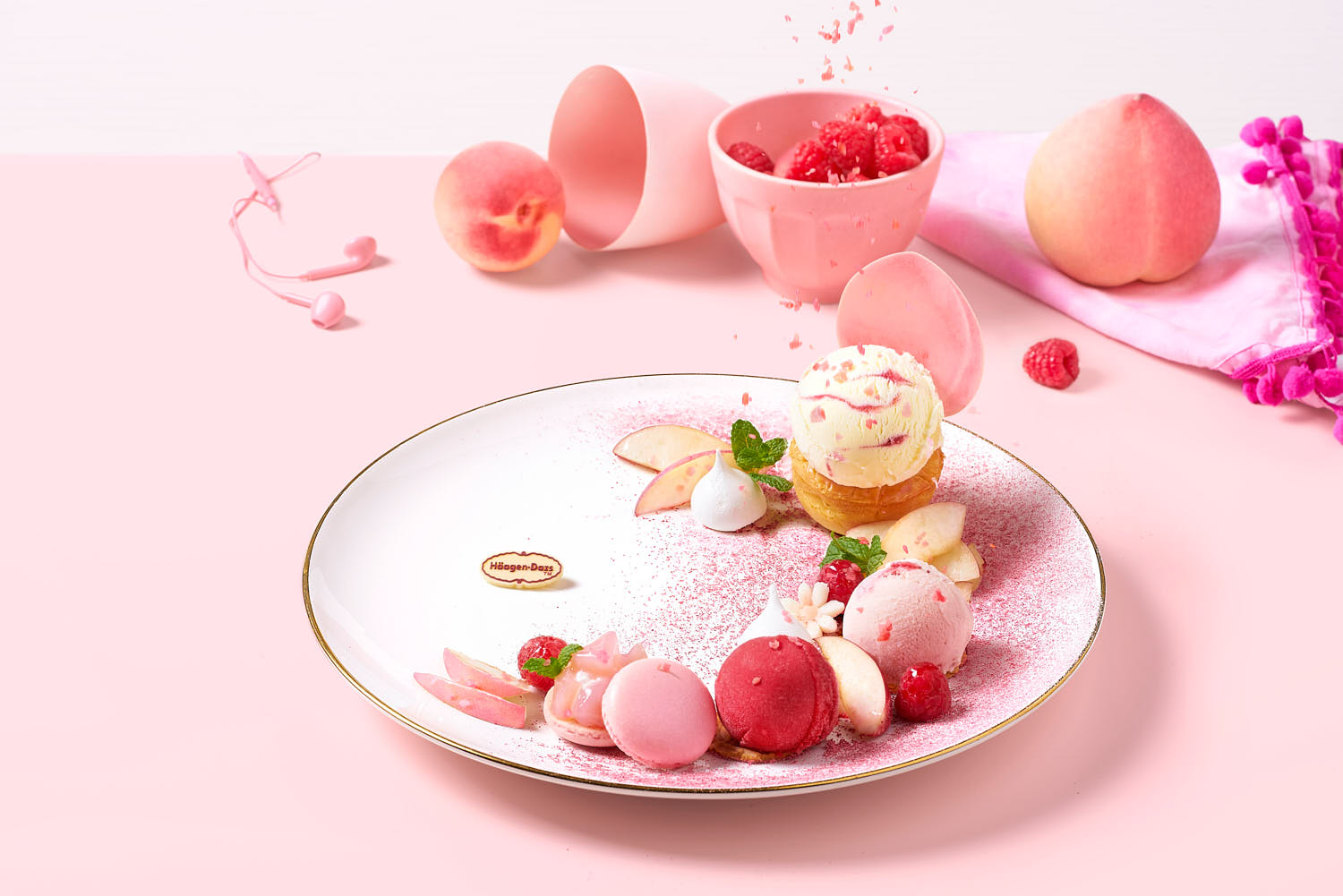 Häagen-Dazs strawberry ice cream, fresh mixed berries, and macaron plate.