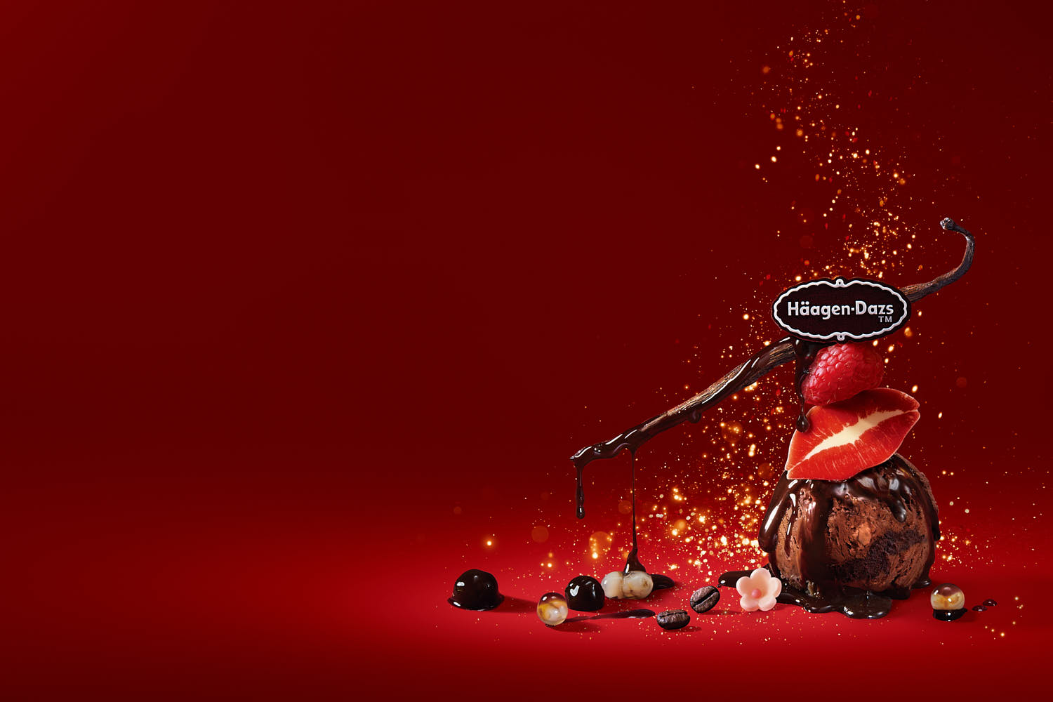 Häagen-Dazs branding shot with chocolate ice cream scoop and elegant gold dust food styling.