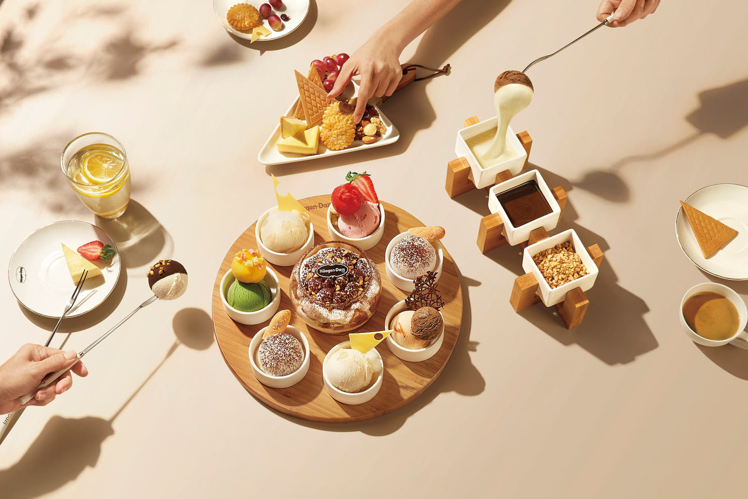 Assorted ice cream scoops in a bowl, paired with rich chocolate, cheese, and crush nuts dips.