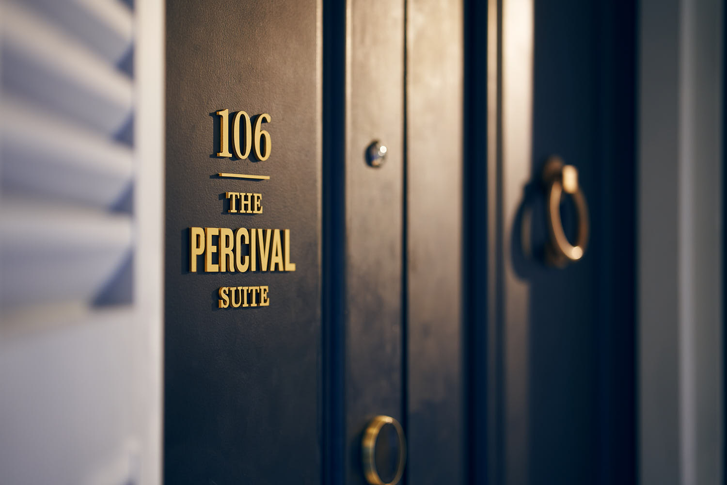 Entrance view of a hotel room at The Barracks Hotel.