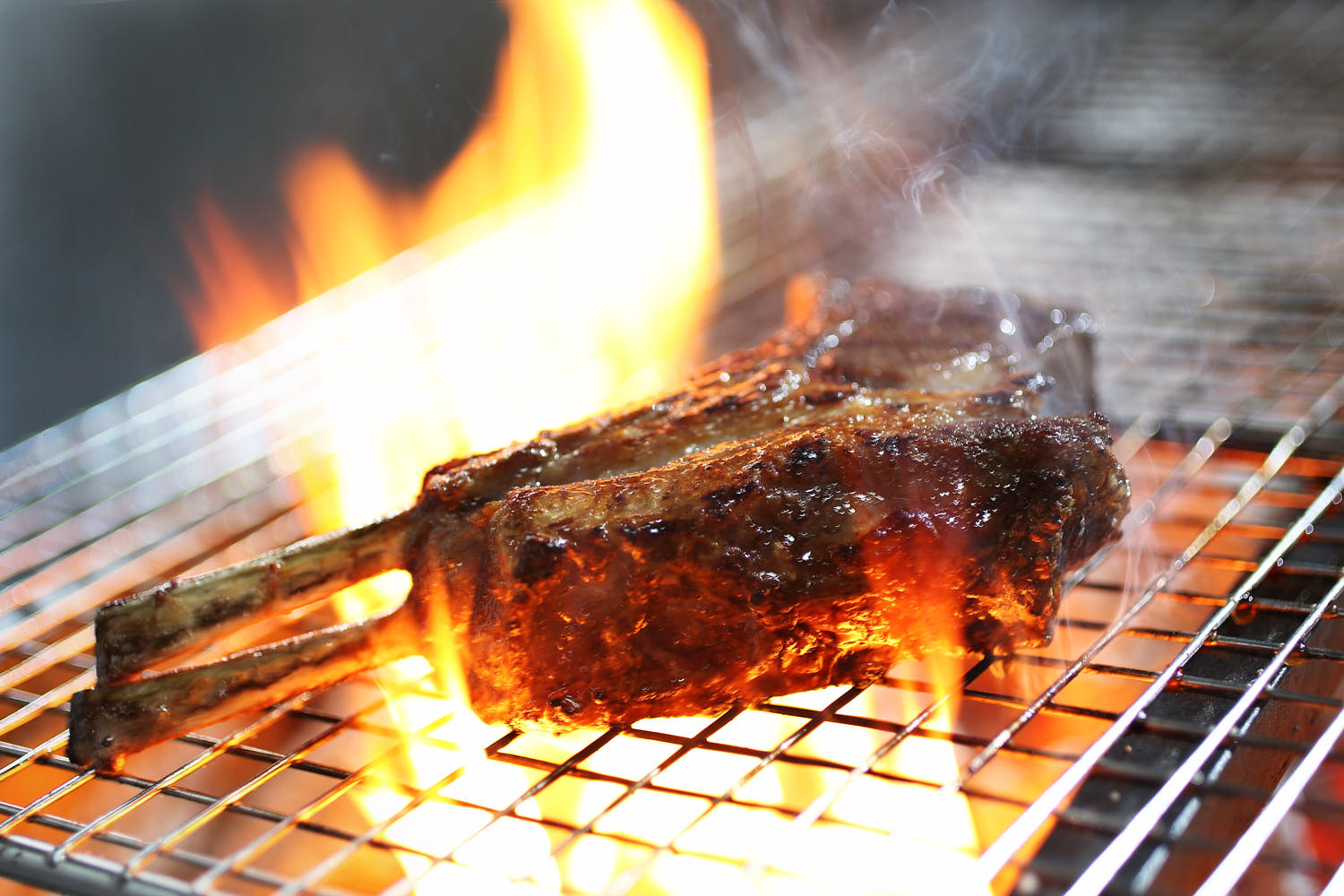 Lamp chop over flame.