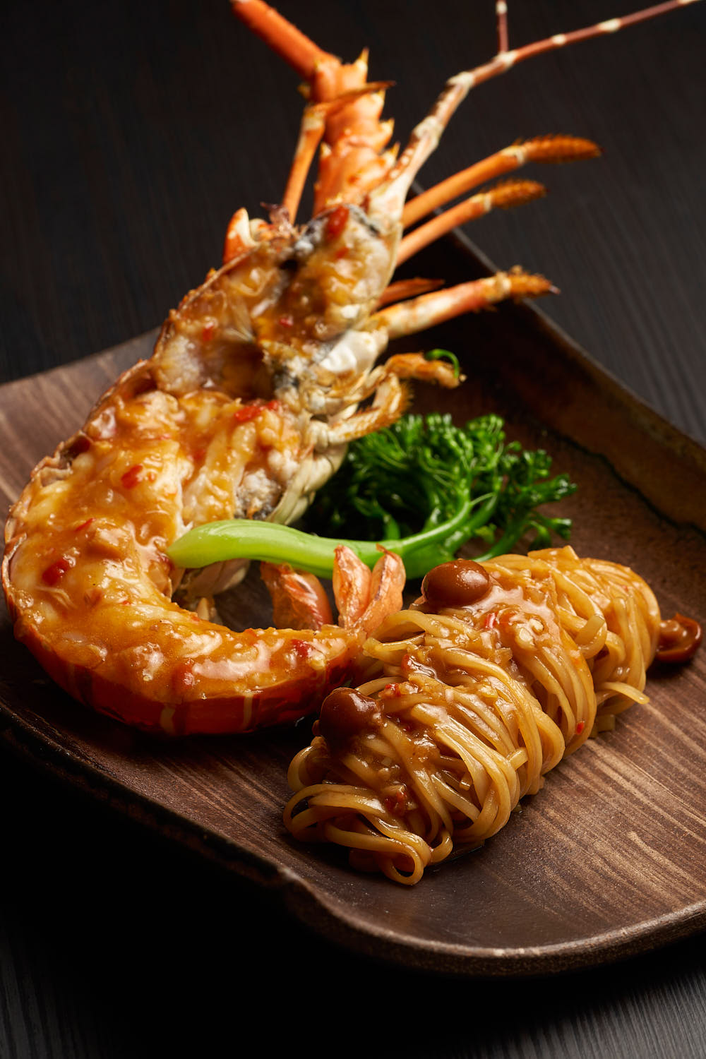 Fresh grilled lobster with noodles.