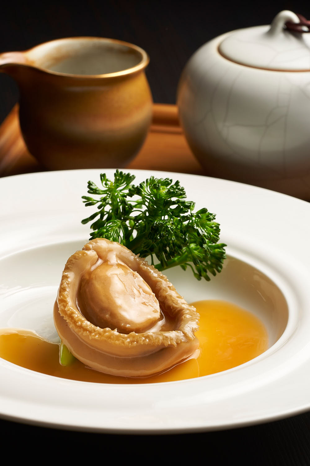 Premium abolone drizzled with savoury sauce.