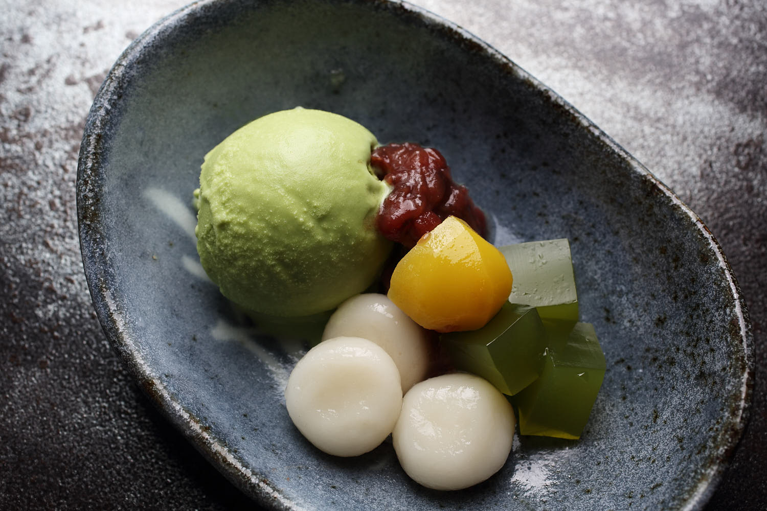 Macha ice cream served with mochi and green bean.