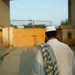 A man walking to his daily prayers in Malakand, Pakistan, August 2010.