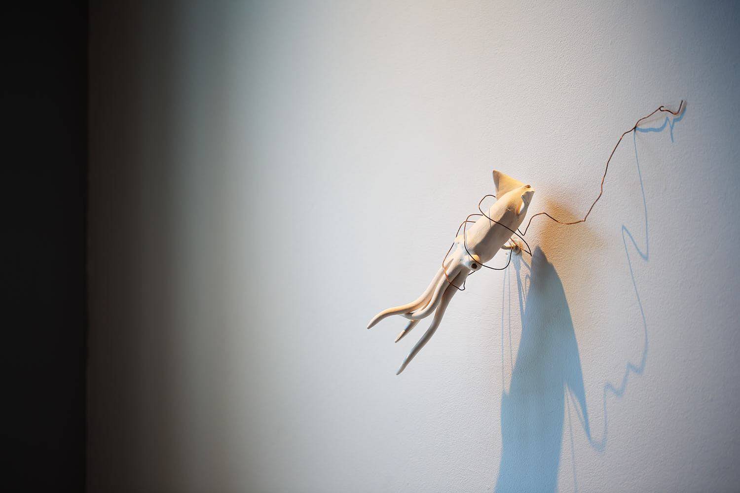 Feature wall with artistic squid design at a Michelin-starred restaurant.