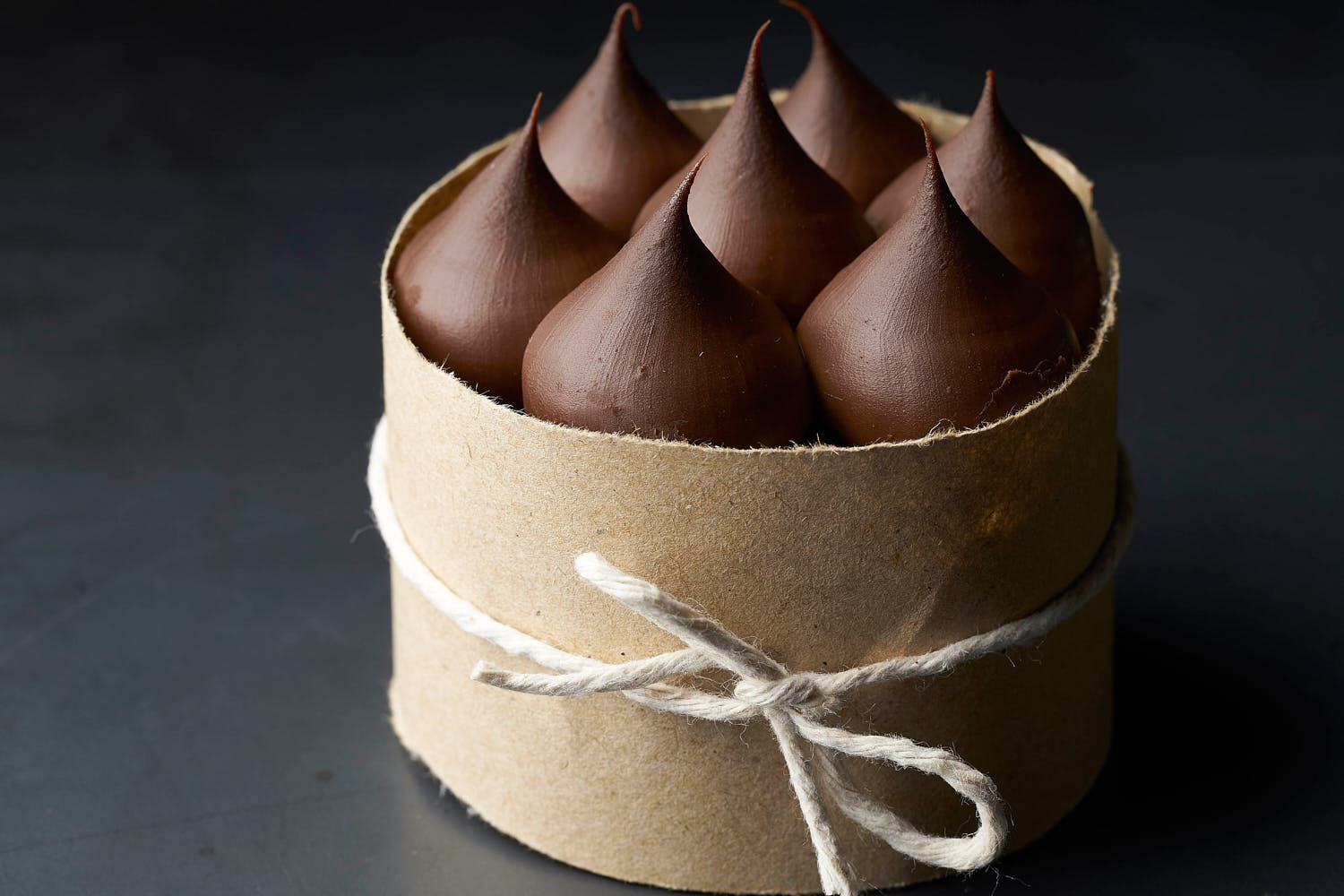 Rich chocolate dessert styled in low light to evoke a warm, indulgent mood.