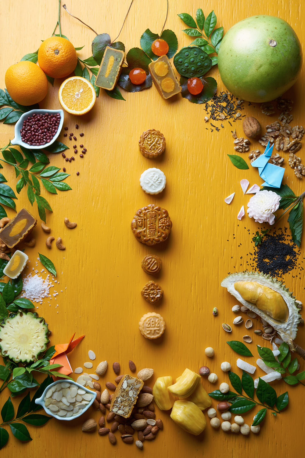 Creative food art of mooncake complemented by an assortment of vibrant fruits for advertising.