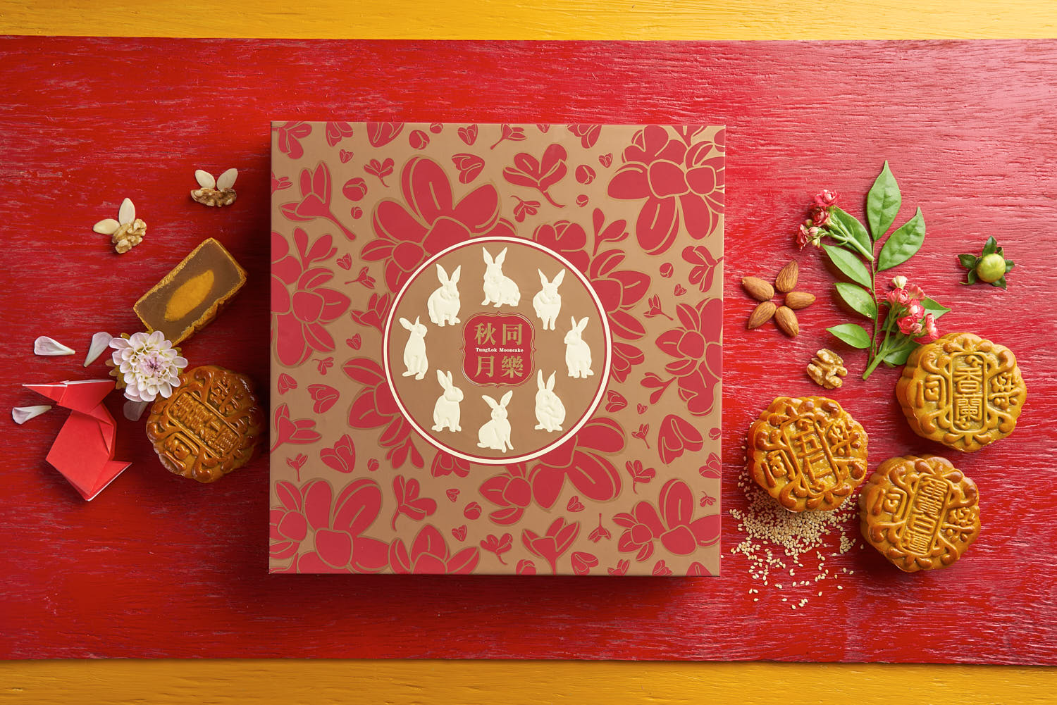 Mooncake showcased on a vibrant red wooden board for a festive food presentation.