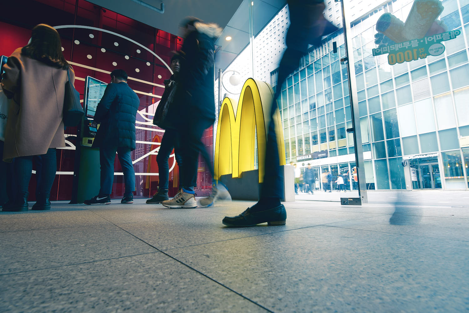 Customer in motion, captured in a dynamic shot while walking through the store.
