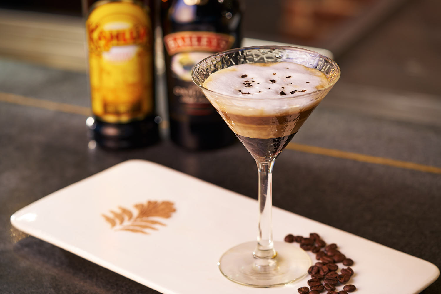 Close-up of a coffee drink infused with liquor, garnished elegantly at Pan Pacific Hotel.