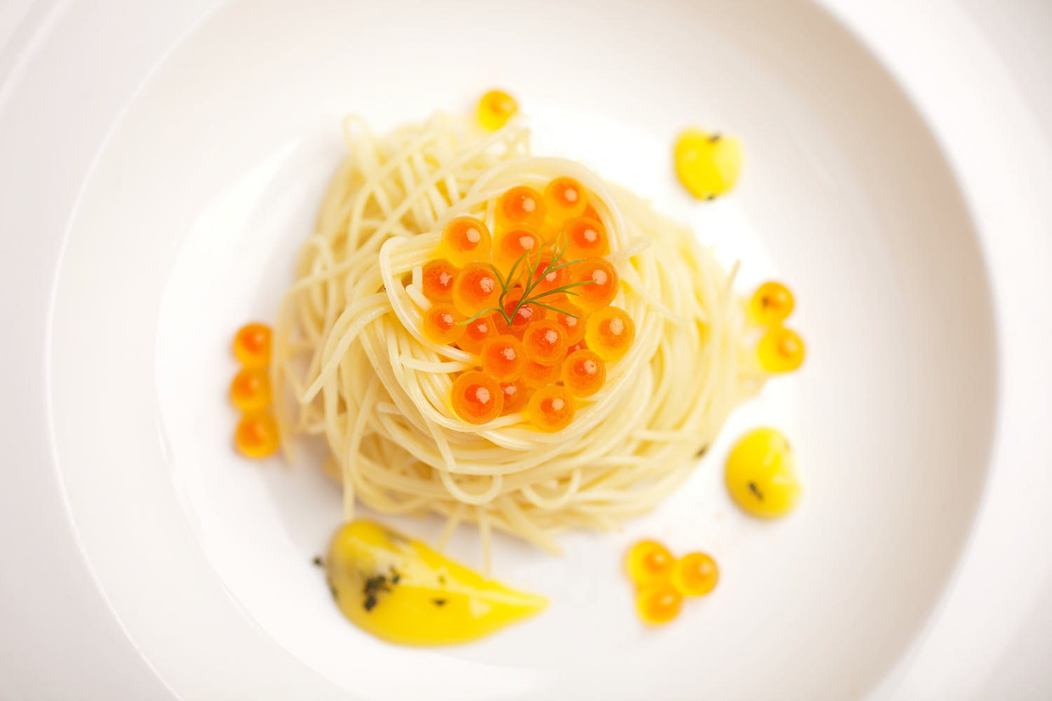 Inviting pasta dish styled with soft lighting to highlight texture and color.