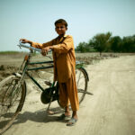 A boy walking to meet his friends in Peshawar, Pakistan, August 2010.