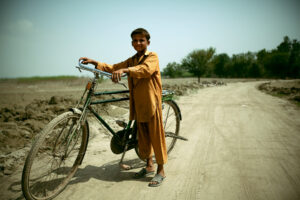 A boy walking to meet his friends in Peshawar, Pakistan, August 2010.