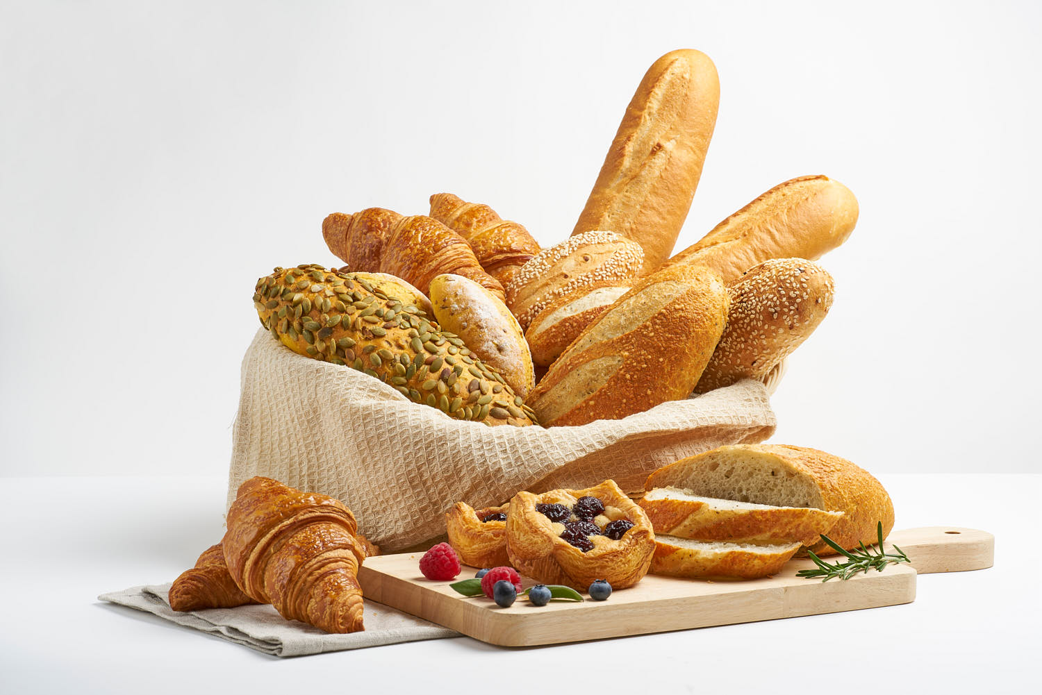 Assortment of freshly baked artisan bread displayed.