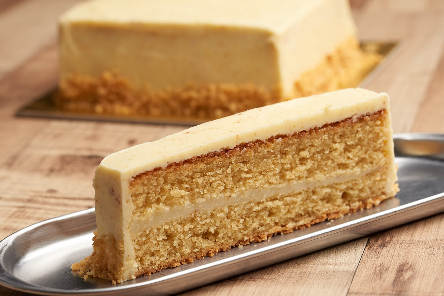 Sliced Sinpopo cake showcasing soft layers and creamy filling.