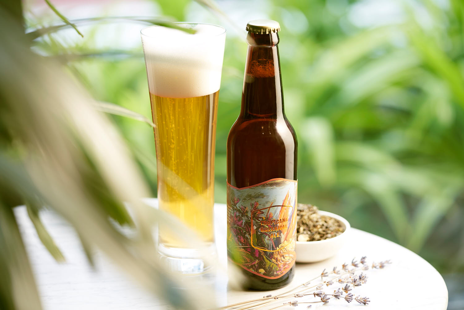 Sofitel craft beer bottle and glass on a table capturing a laid-back lifestyle vibe.