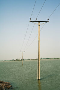 Electrical cables leading to a village submerged underwater in Sujawal, Pakistan, August 2010.