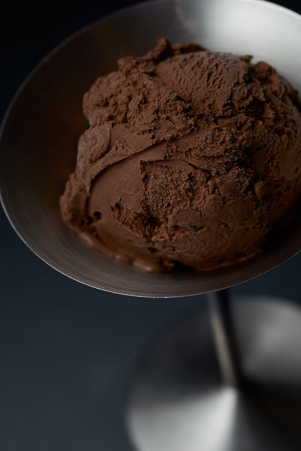 Close-up of creamy chocolate ice cream with rich texture and velvety surface.