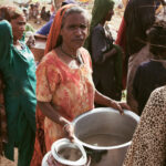 A woman expressing the struggle of insufficient resources for her family in Thatta, Pakistan, August 2010.